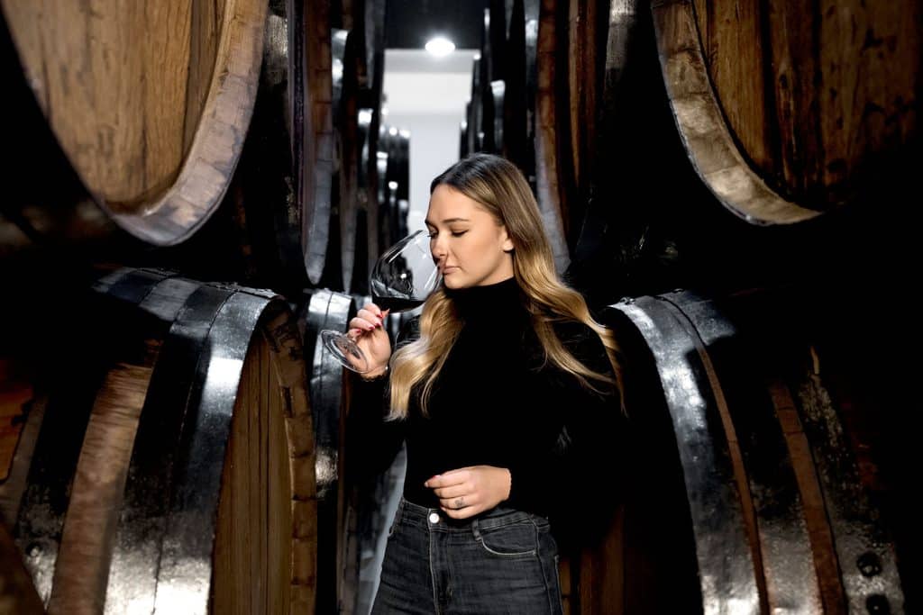 medium-shot-woman-tasting-wine